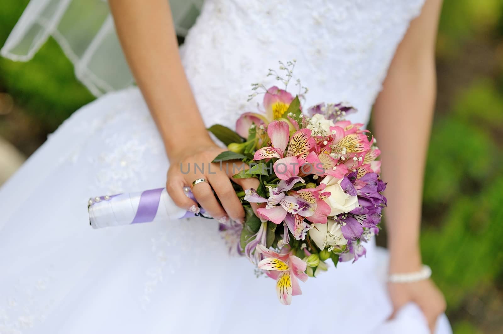 Bride with wedding  bouquet, closeup