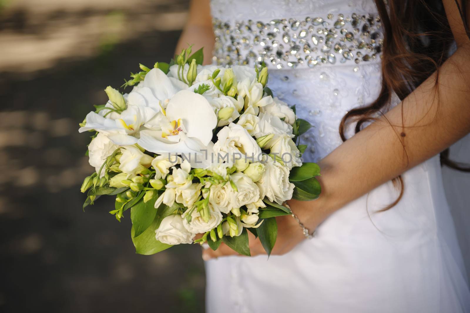bride holding a wedding bouquet in hands