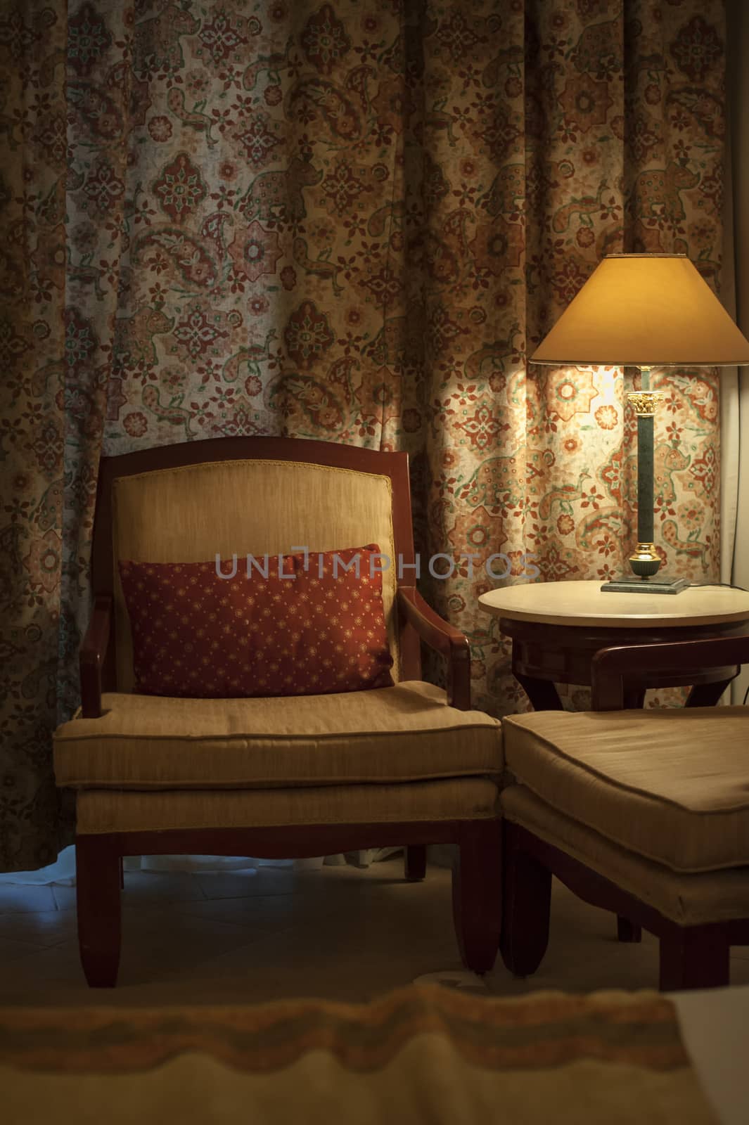 beautiful armchair and lamp in a hotel room