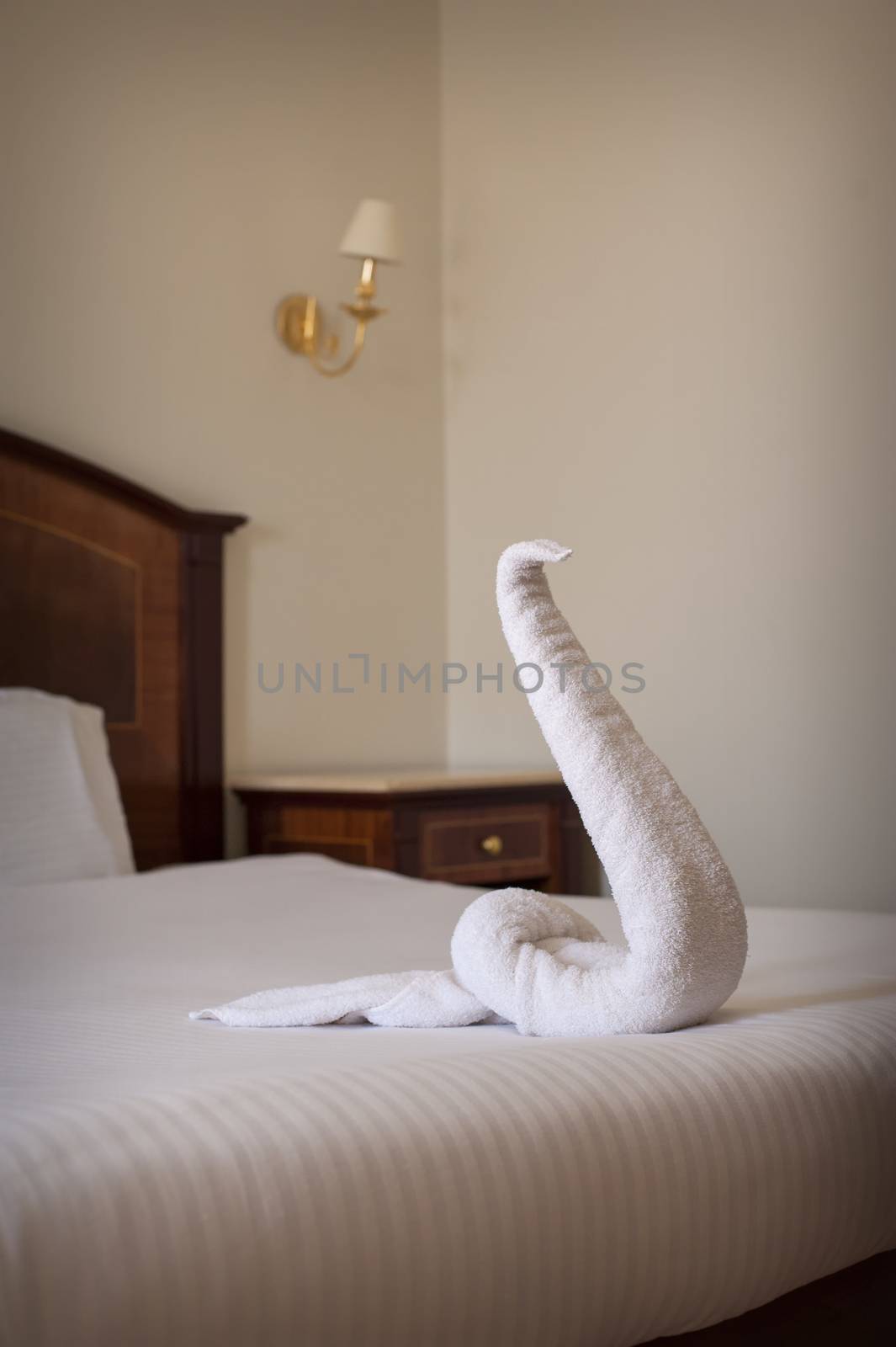 Luxurious Hotel bed close up towel