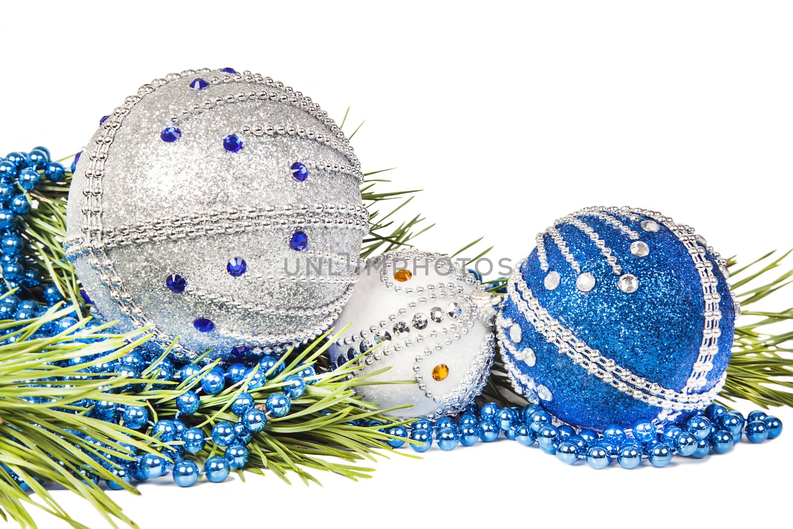 Christmas tree branch and blue with white glitter balls isolated