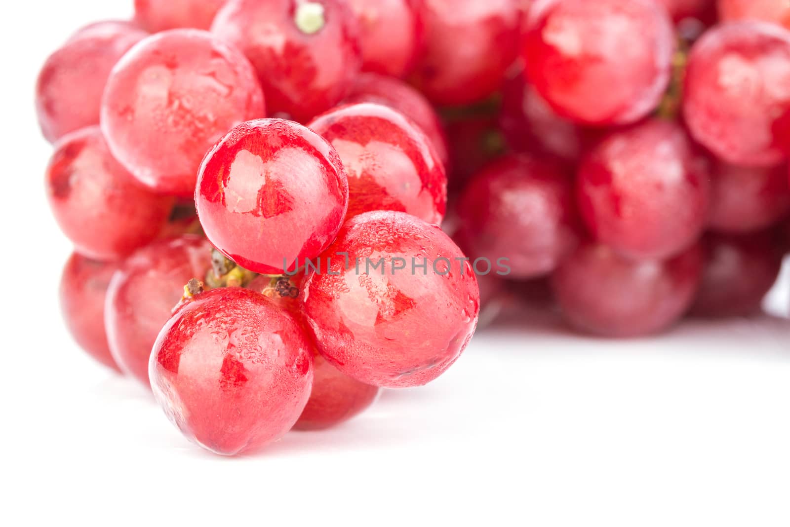 fresh bunch of red soak grape on white background