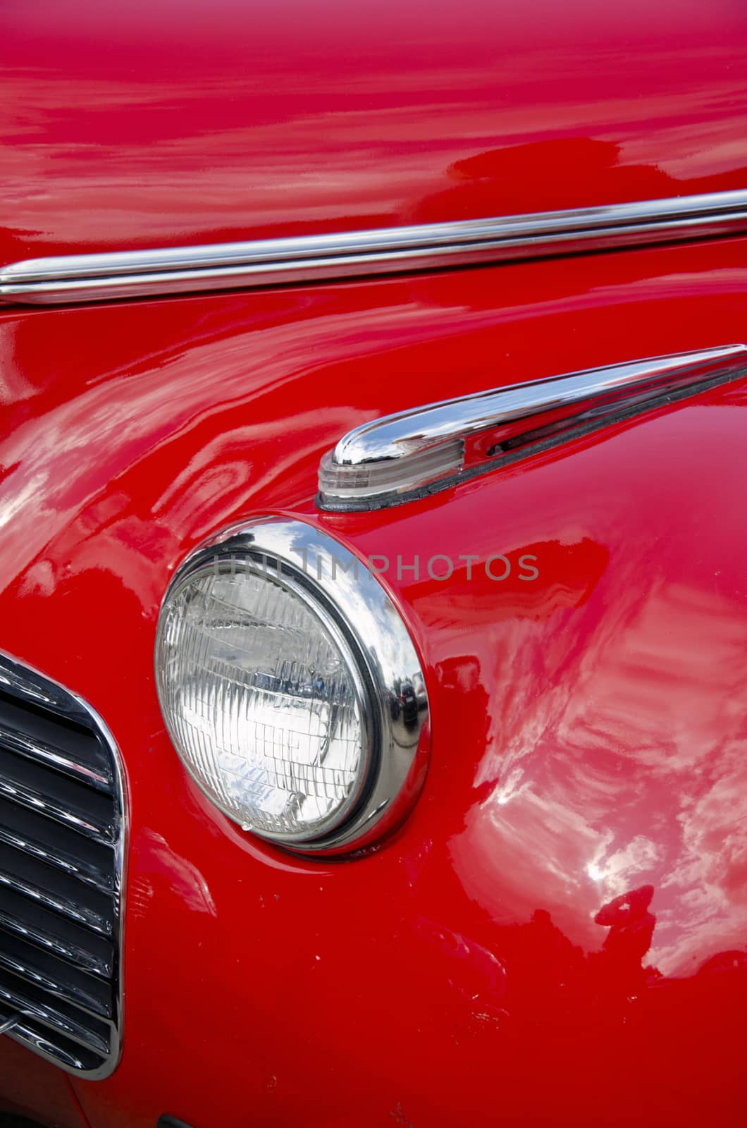 Headlight of antique red car