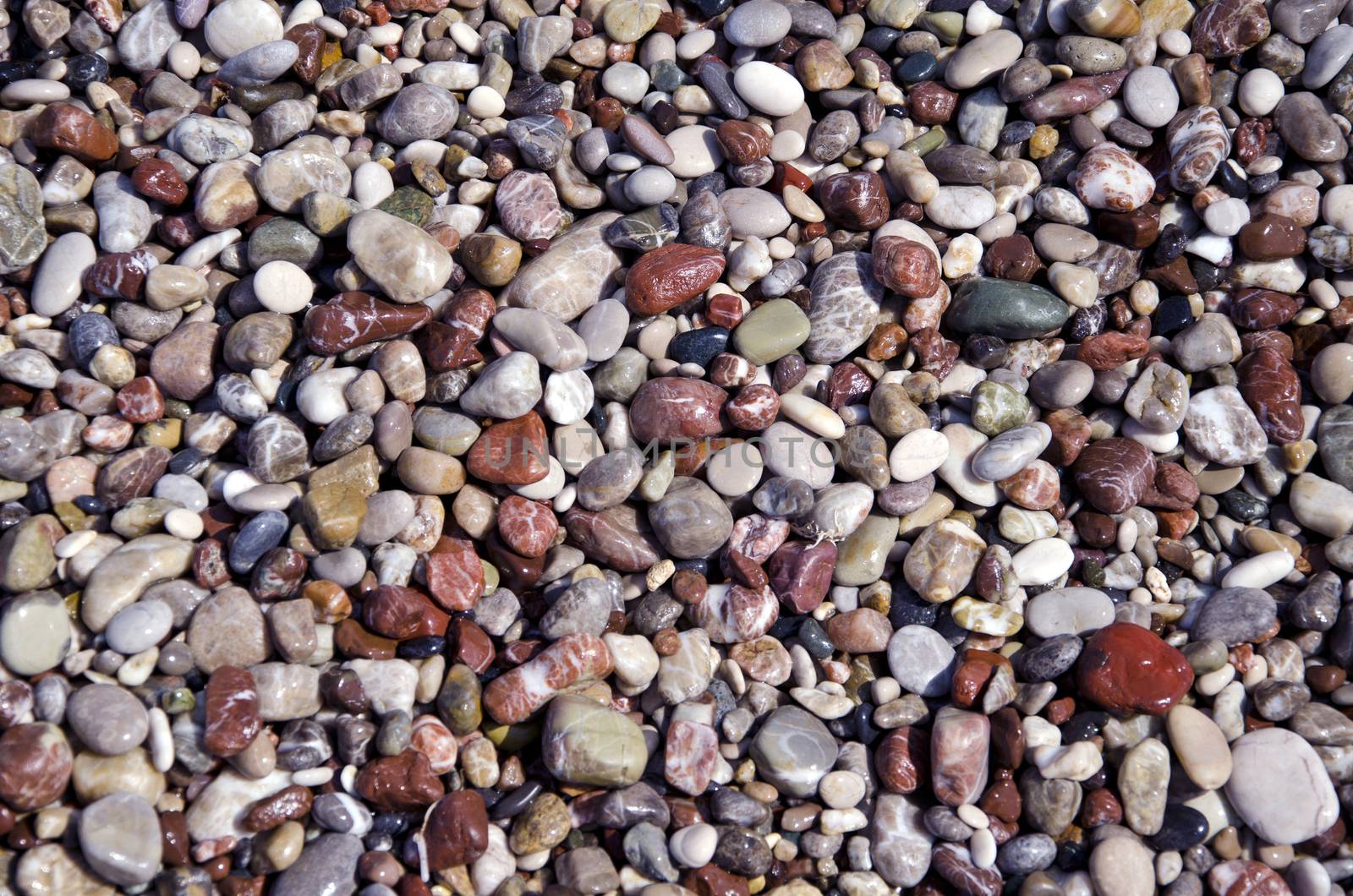 Mediterranean sea wet pebbles beautiful nature background and texture