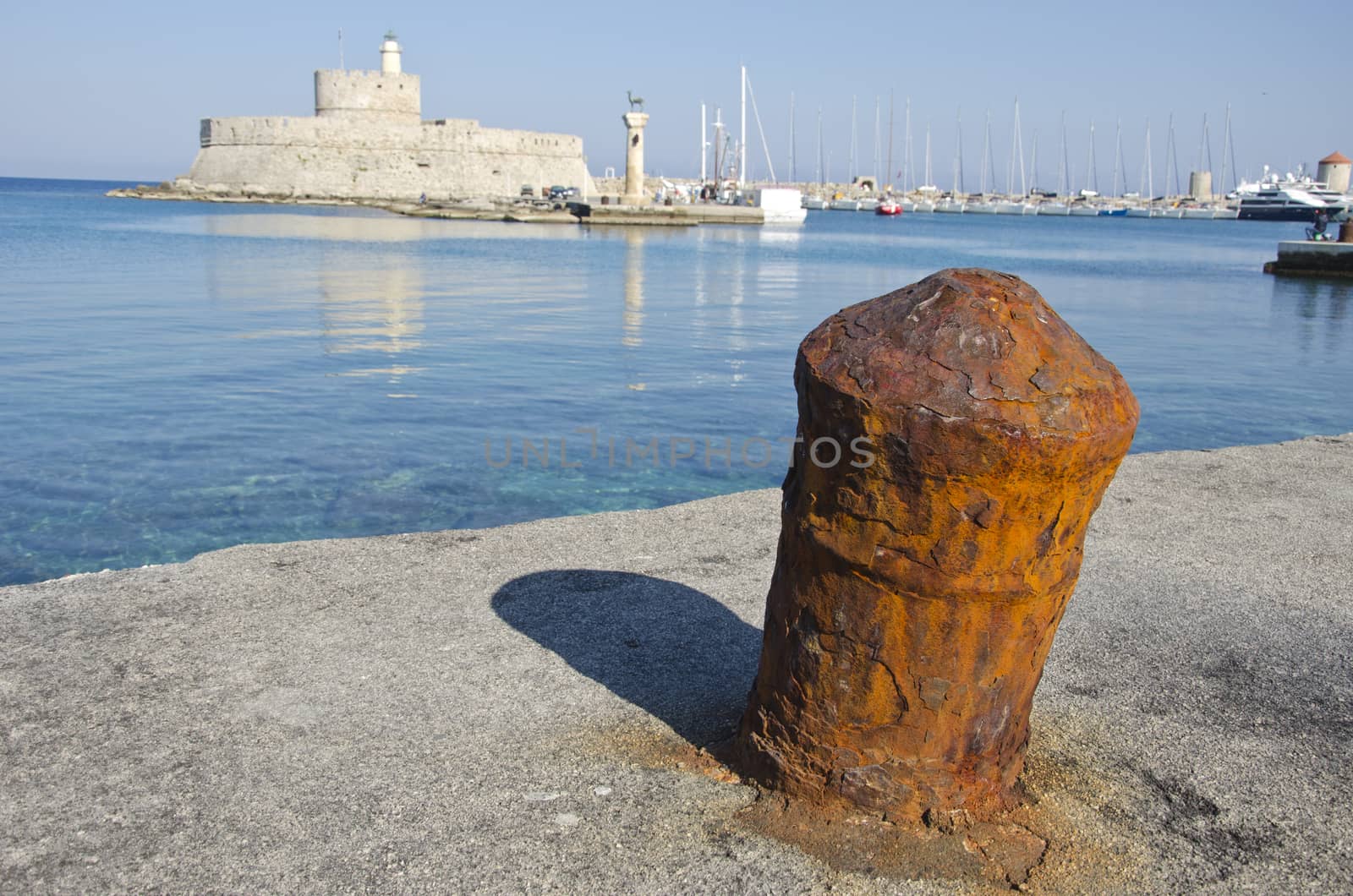 Rusty ship port bollard in Greek island, Rhodes, Greece