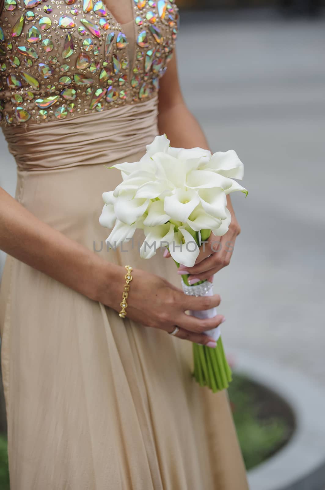 Bride hold her calla wedding bouquet 