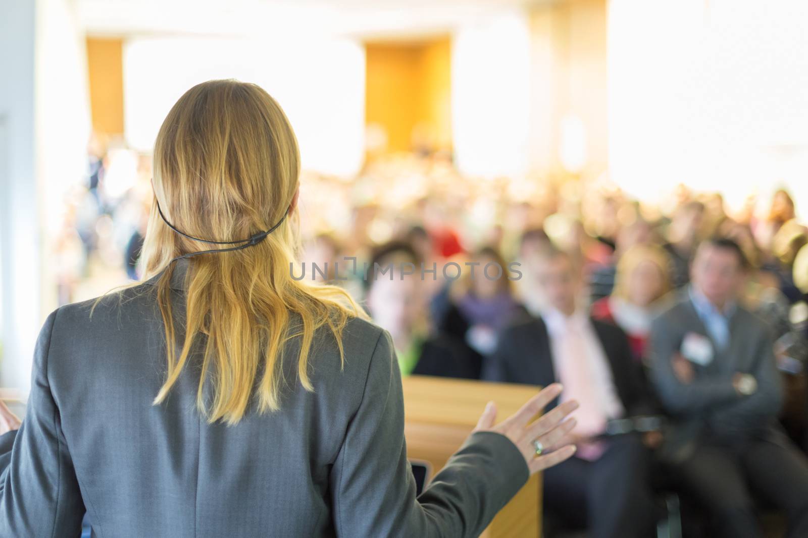 Female speaker at Business Conference and Presentation. Audience at the conference hall. Business and Entrepreneurship. Business woman.