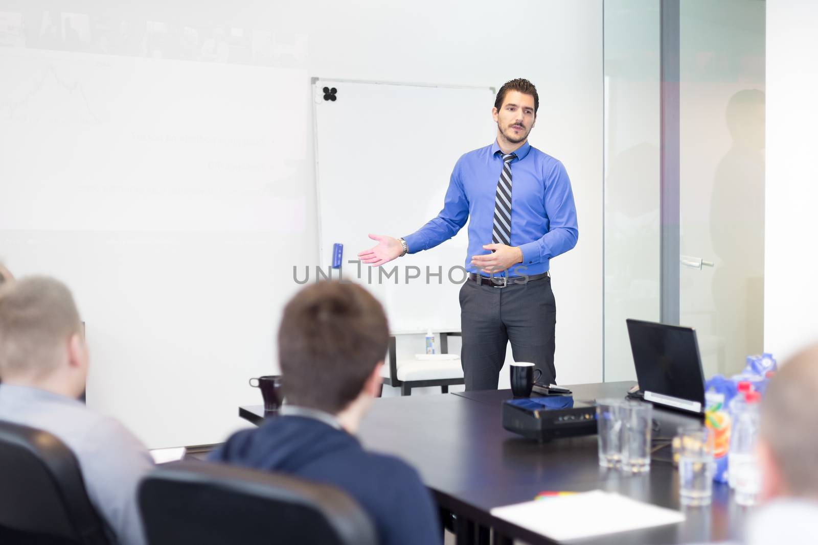 Business man making a presentation in office on job interview. Business presentation on corporate meeting. Recruiters evaluating the candidate. 