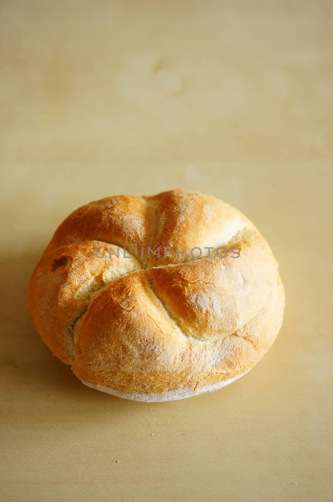 Whole bread on wooden background