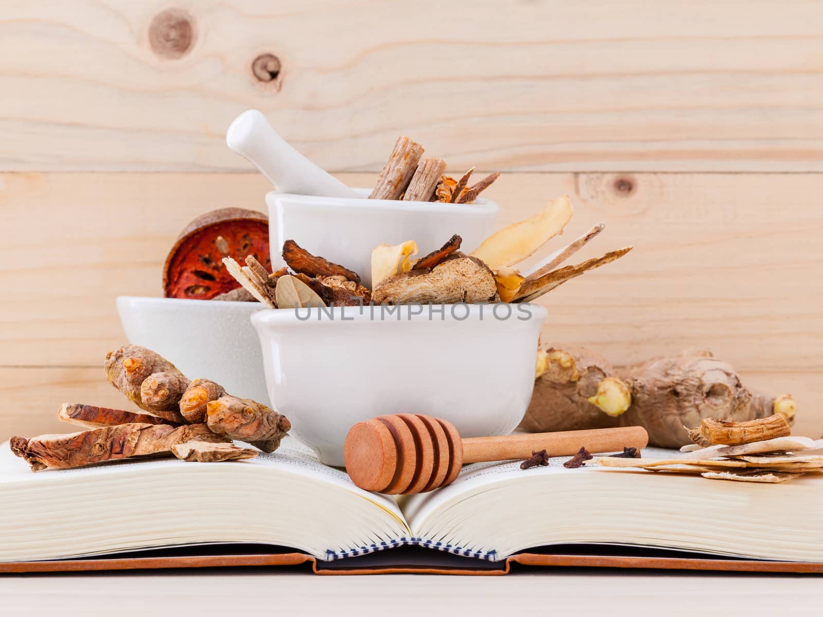 Alternative Medicinal , Chinese herbal medicine  for healthy recipe with dry herbs  and mortar on wooden background.