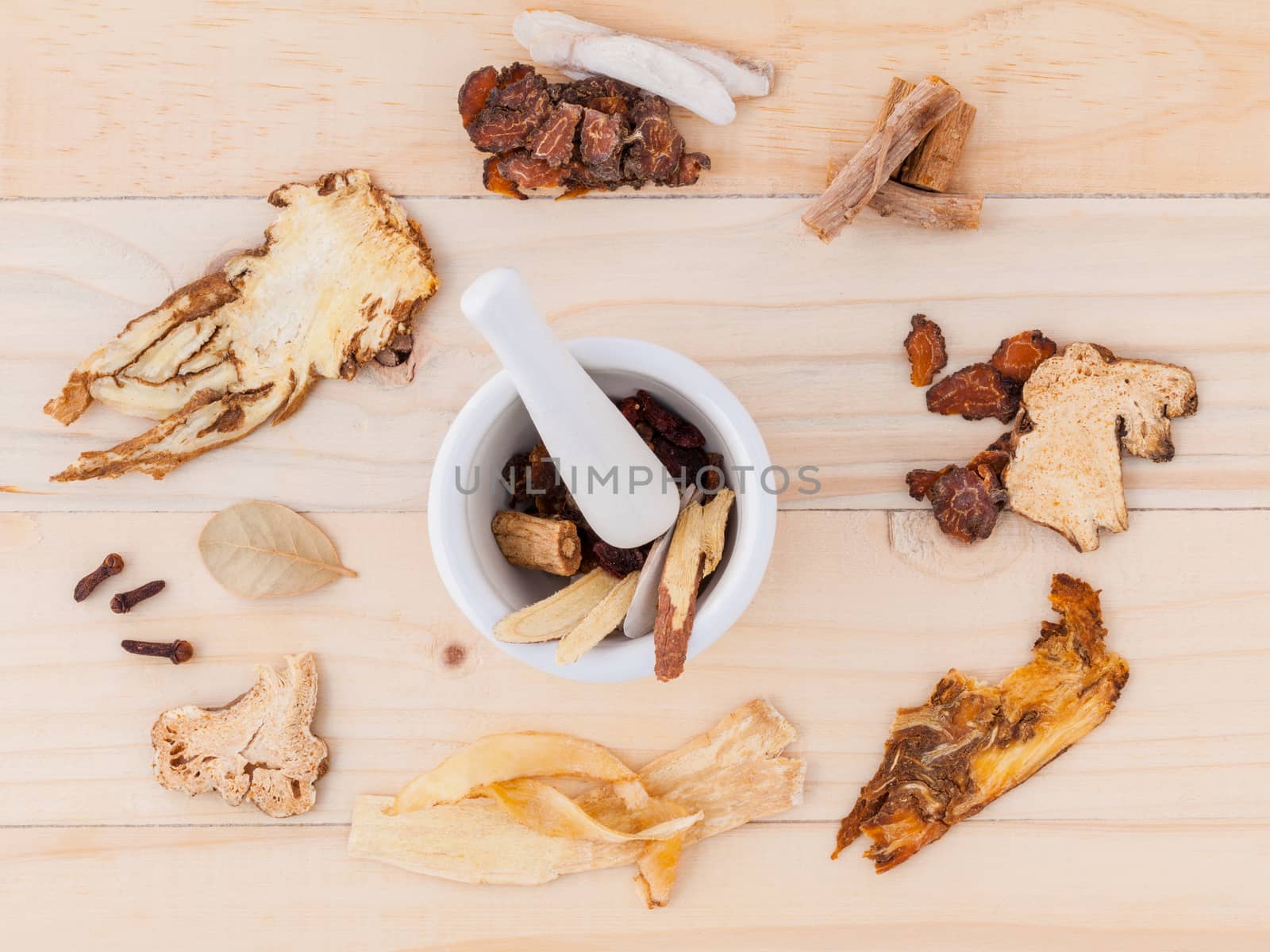 Alternative Medicinal , Chinese herbal medicine  for healthy recipe with dry herbs  and mortar on wooden background.