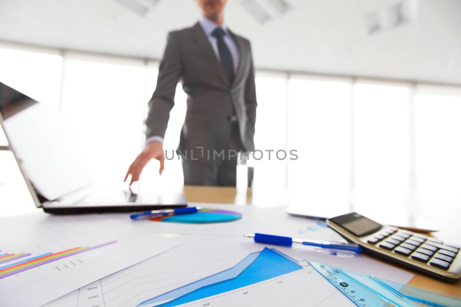 Businessman and documents by ALotOfPeople