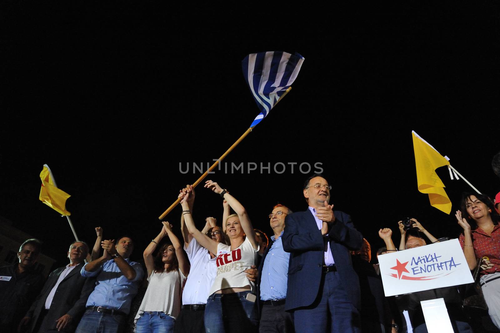 GREECE, Athens: Popular Unity party leader Panagiotis Lafazanis and other election candidates wave at supporters at the party's main pre-election rally in Athens on September 15, 2015. Greece's snap election takes place on September 20, with Syriza leader Alexis Tsipras and New Democracy's Evangelos Meimarakis the frontrunners.