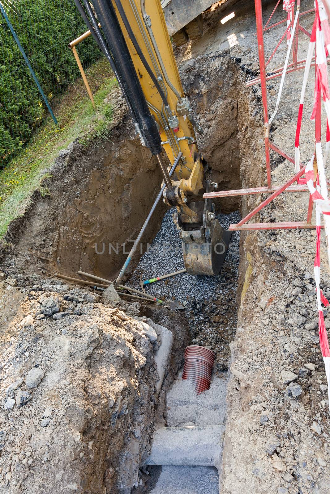 excavator on trench - constructing canalization in european project - wastewater treatment plant, ecology project