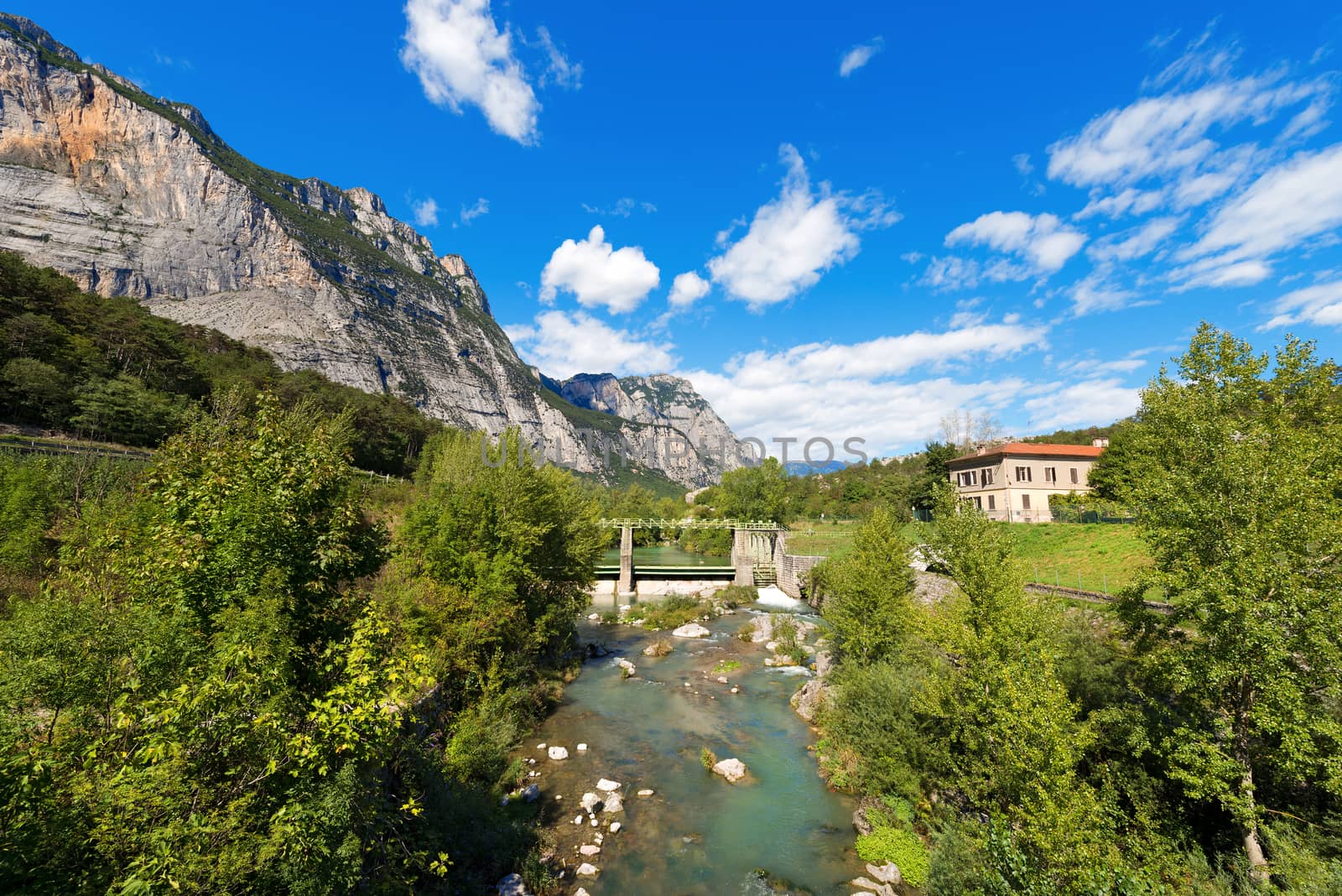 The Sarca River with old dam in the Sarca Valley in Trentino Alto Adige, Italy, Europe