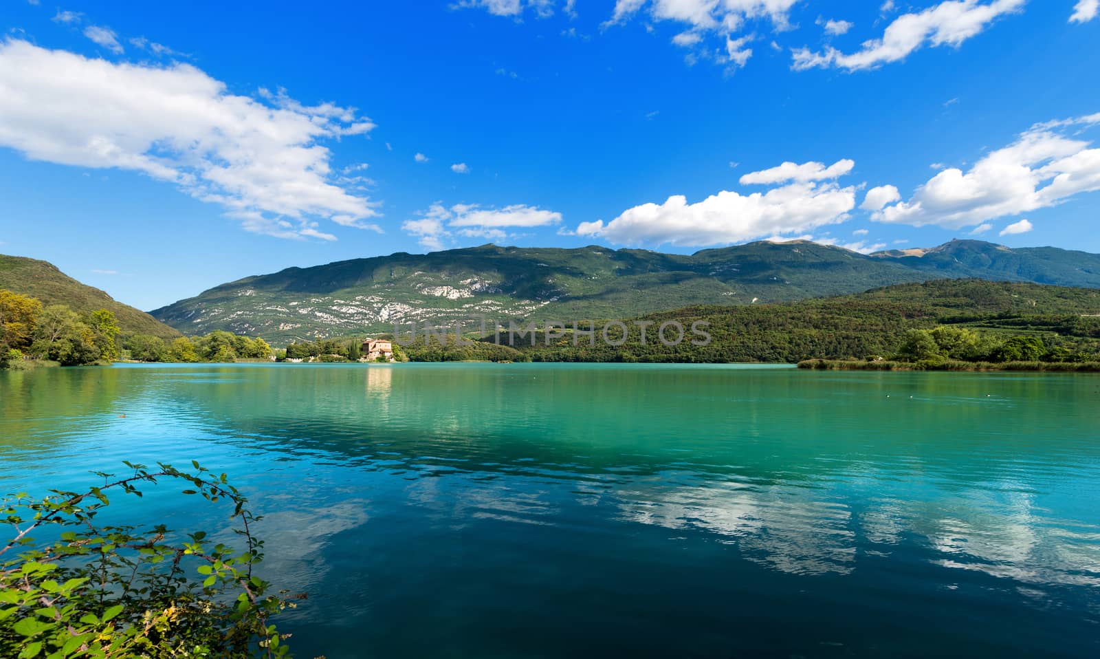 Toblino Lake (Lago di Toblino) with a medieval castle, small alpine lake in Trentino Alto Adige, Italy, Europe