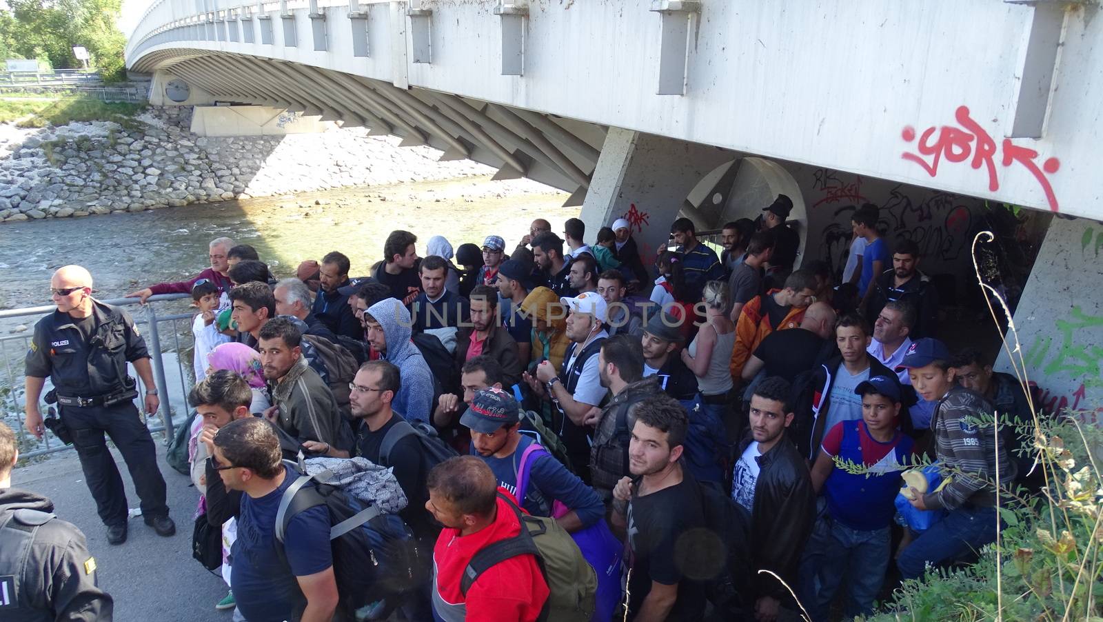 GERMANY, Freilassing: Refugees wait at the gates of Freilassing, Bavaria, on the German side of the Germany-Austria border, September 16, 2015.