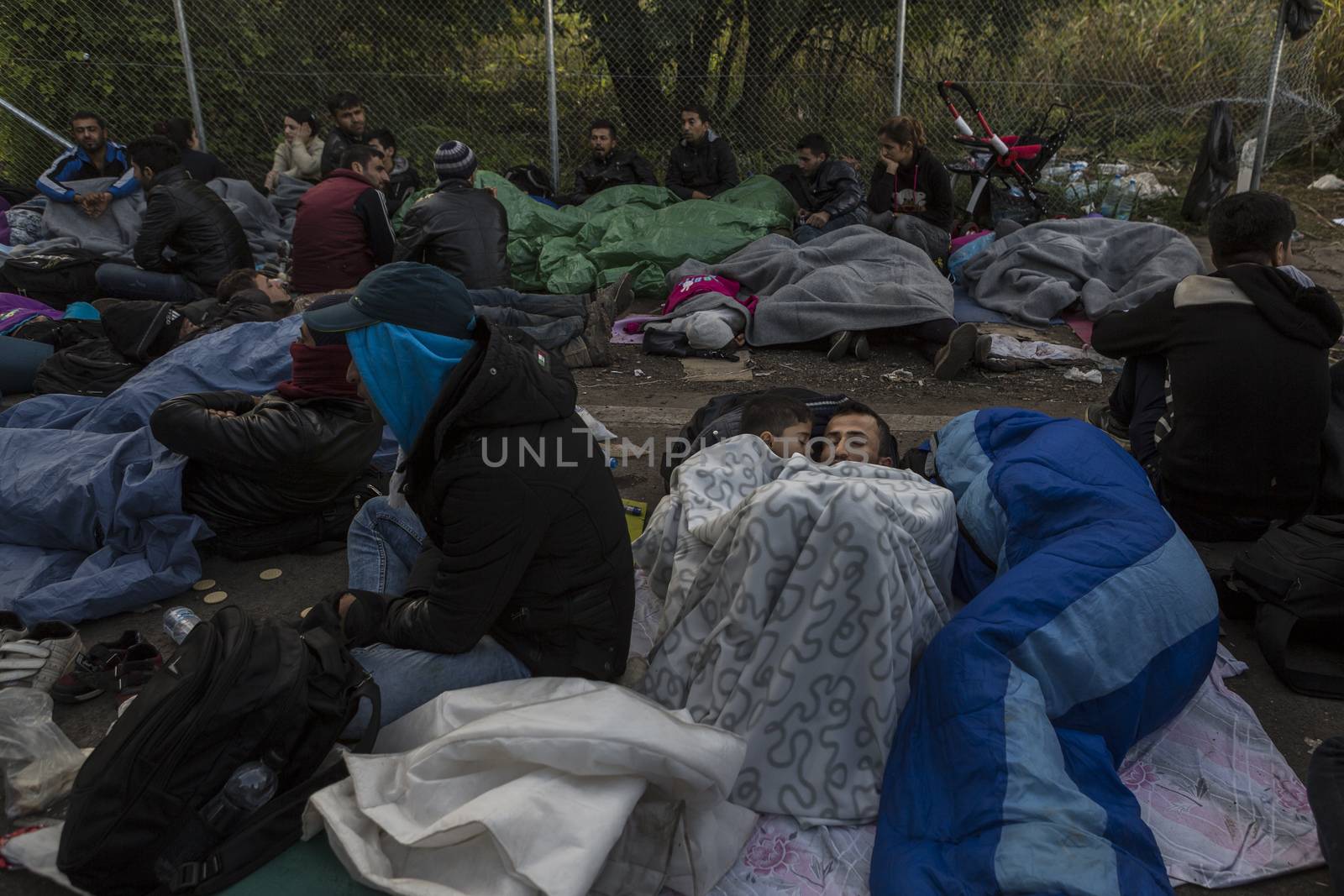 SERBIA, Horgos: Refugees lie and wait at the Serbia-Hungary border after Hungary closed the border crossing on September 16, 2015.****Restriction: Photo is not to be sold in Russia or Asia****