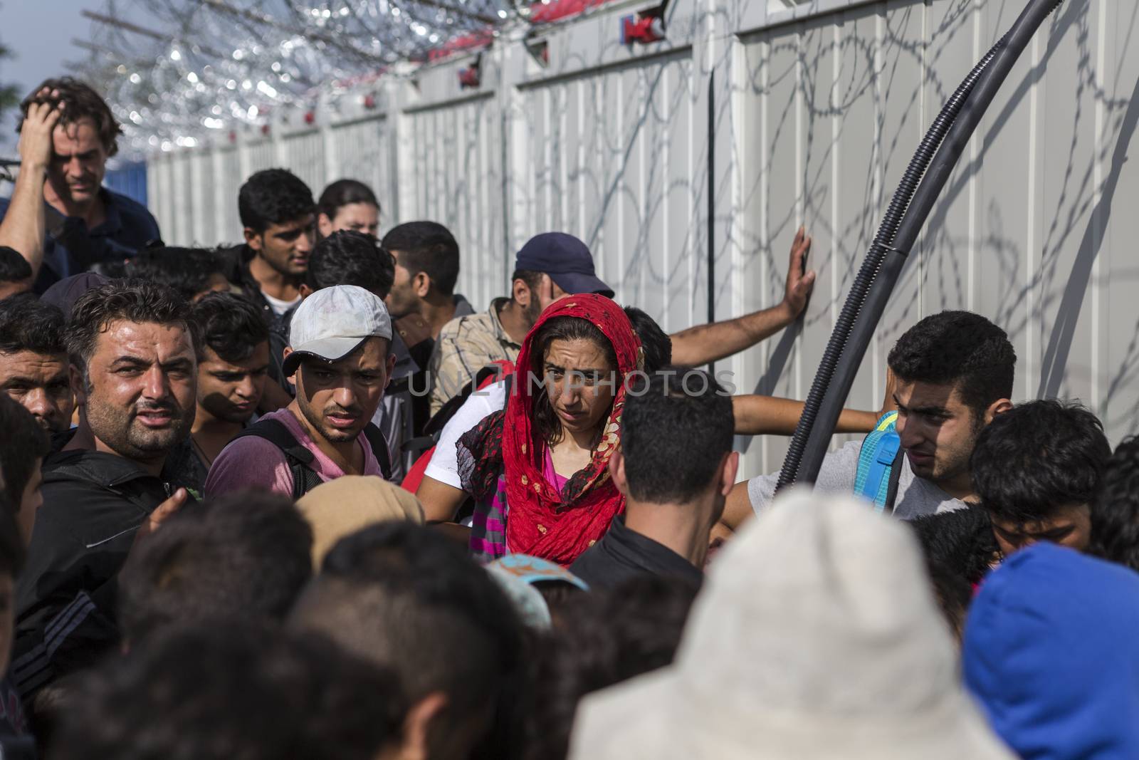 SERBIA, Horgos: Refugees stand at the Serbia-Hungary border after Hungary closed the border crossing on September 16, 2015.****Restriction: Photo is not to be sold in Russia or Asia****