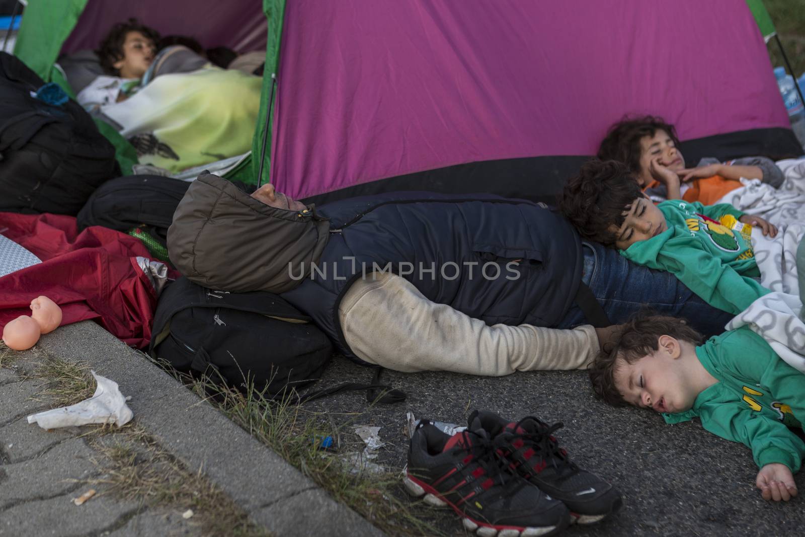 SERBIA, Horgos: Refugees wait at the Serbia-Hungary border, blocking traffic, after Hungary closed the border crossing on September 16, 2015.****Restriction: Photo is not to be sold in Russia or Asia****