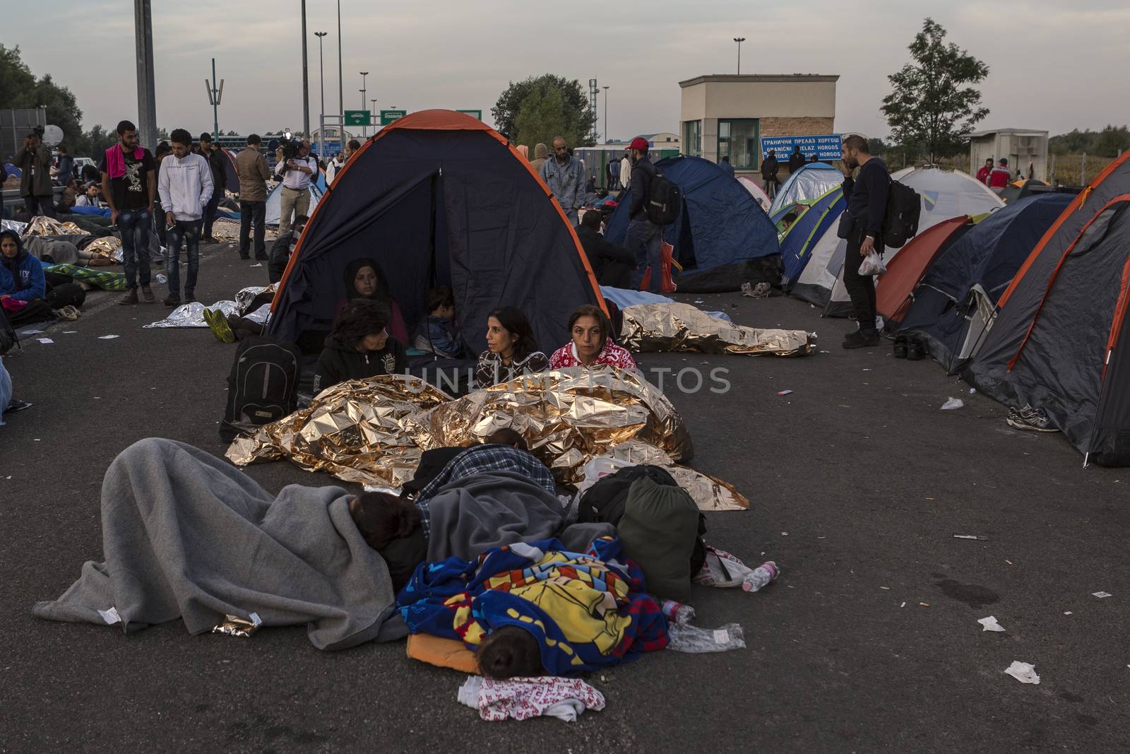 SERBIA, Horgos: Refugees wait at the Serbia-Hungary border, blocking traffic, after Hungary closed the border crossing on September 16, 2015.****Restriction: Photo is not to be sold in Russia or Asia****