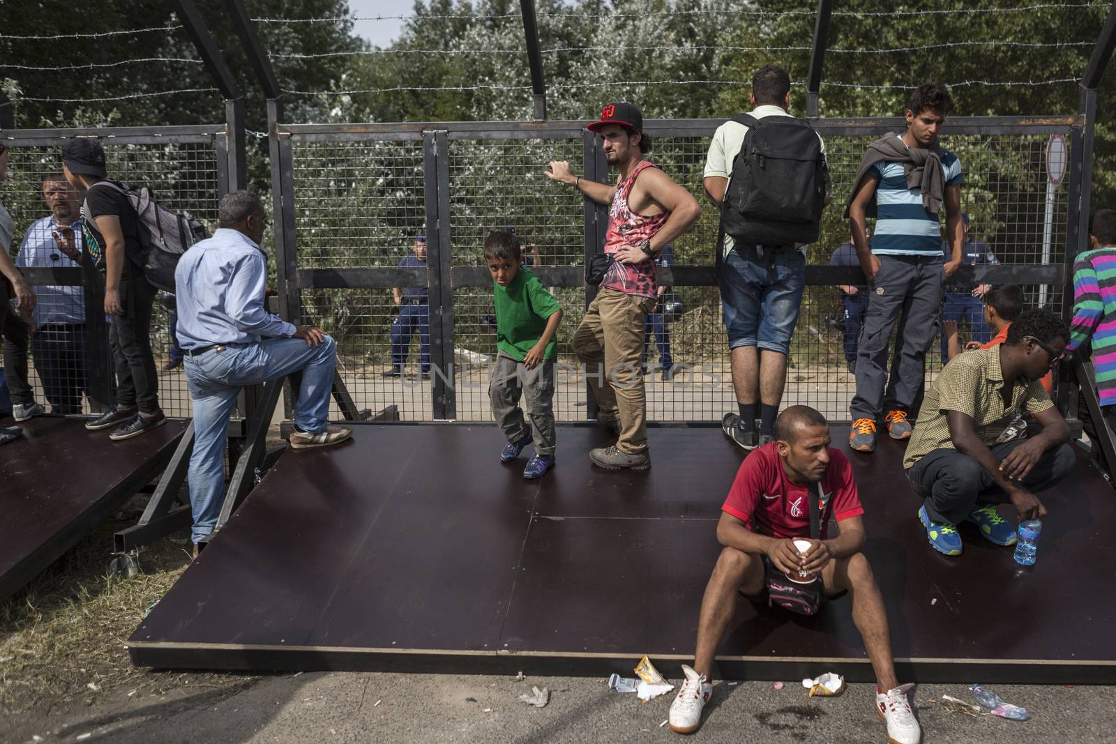 SERBIA, Horgos: Refugees wait at the Serbia-Hungary border, blocking traffic, after Hungary closed the border crossing on September 16, 2015.****Restriction: Photo is not to be sold in Russia or Asia****