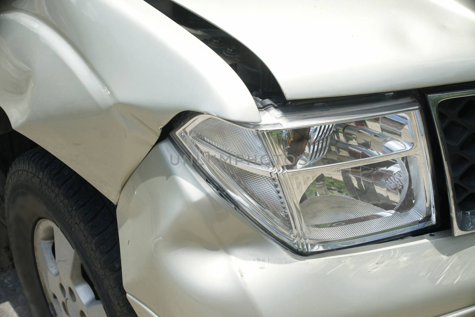 A dent on the right front of a pickup truck (damage from crash accident)