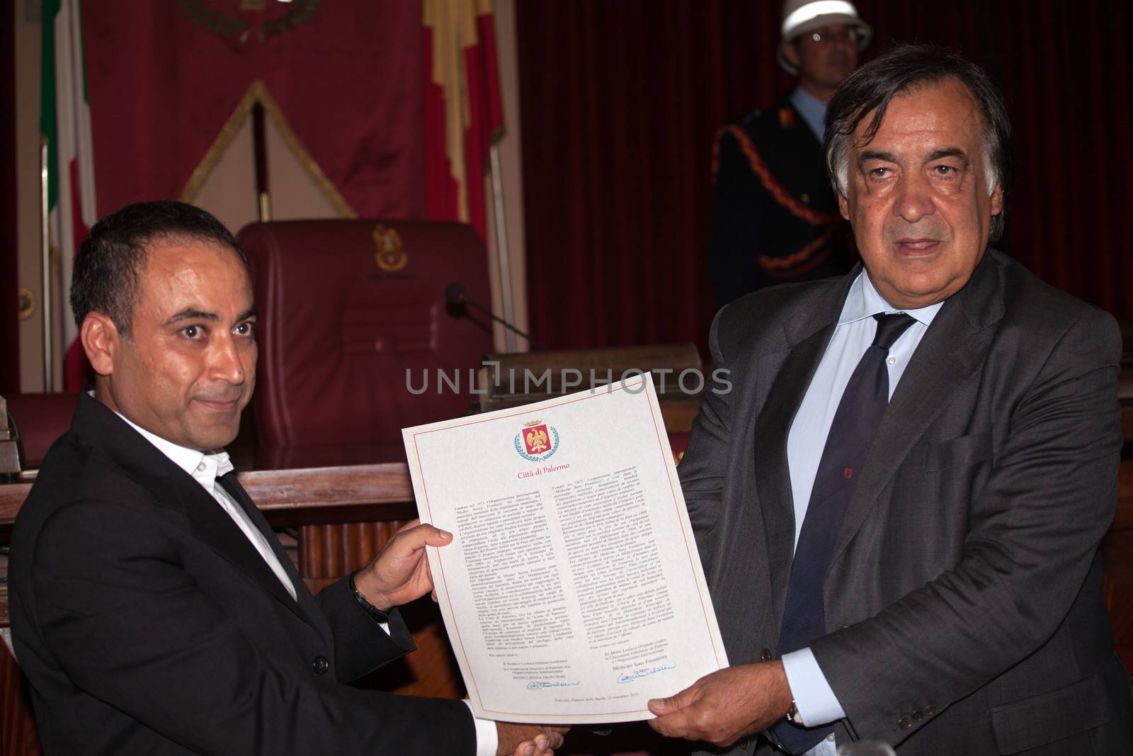 ITALY, Palermo: Doctors Without Borders cultural mediator Ahmad Al Rousan receives an honorary citizenship from Palermo Mayor Leoluca Orlando on September 16, 2015. 