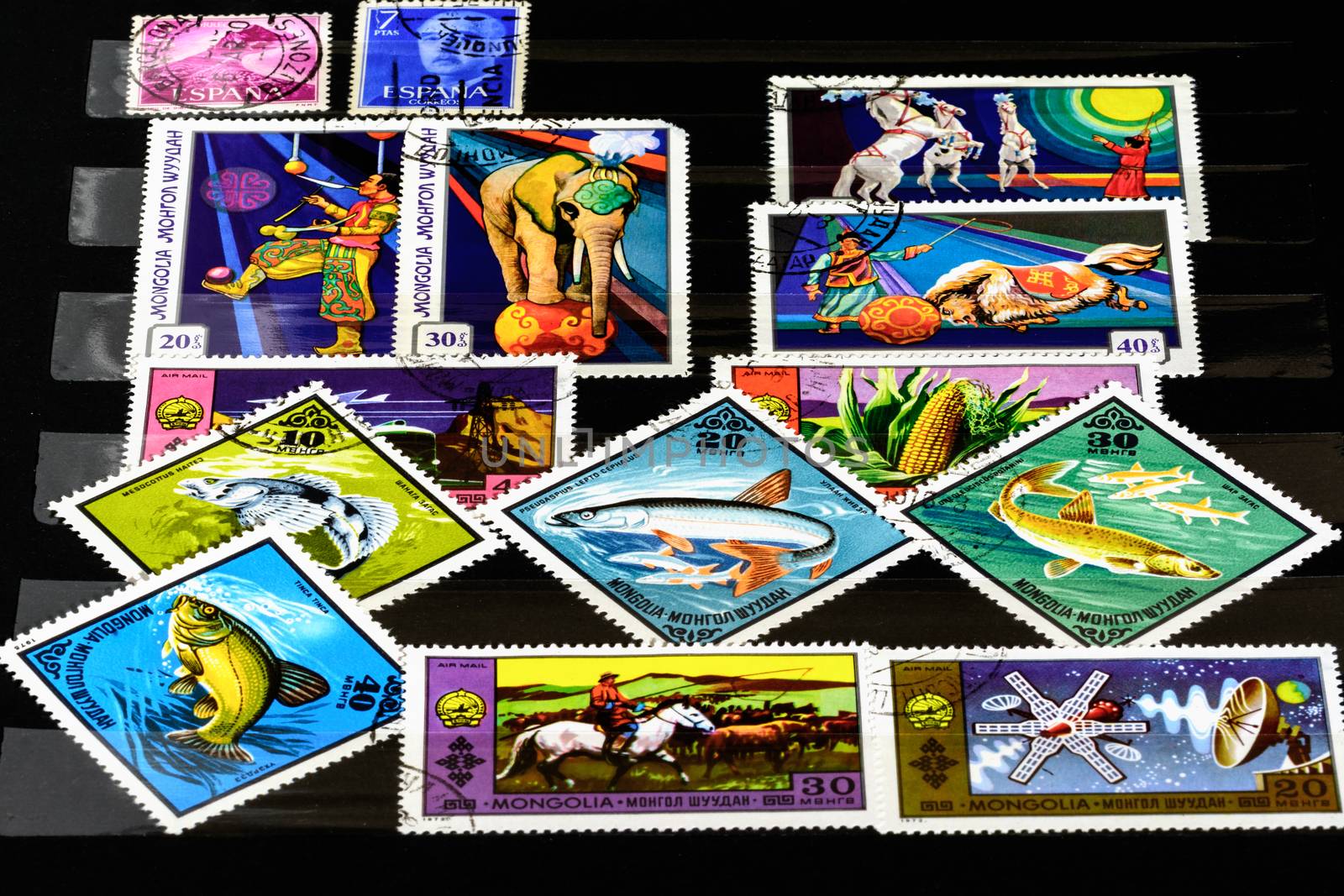 Milan, Italy- 23 November 2014: In the picture Mongolia and espana stamp.