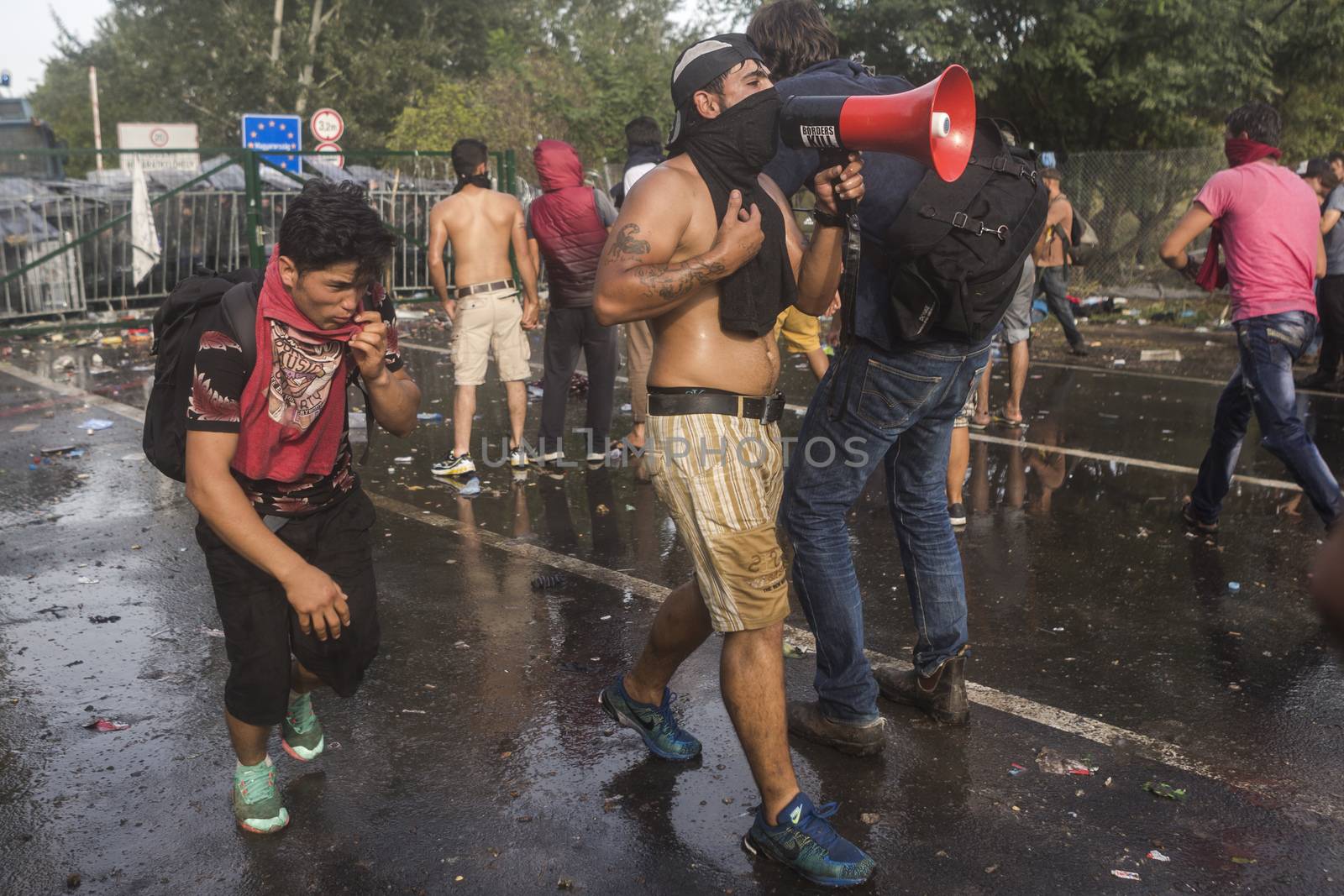 SERBIA, Horgos: Hungarian police fire tear gas and water cannons into the refugees in the Serbian border town of Horgos on September 16, 2015, after Hungary closed its border in an effort to stem the wave of refugees entering the country. 