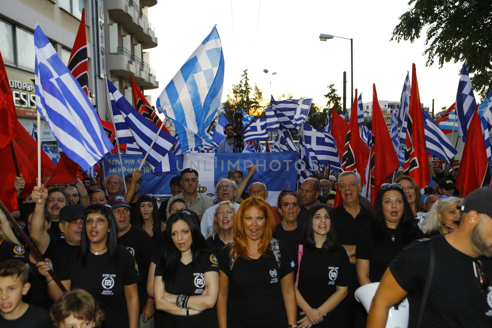 GREECE, Athens: Supporters gather as Greece's far-right Golden Dawn party holds an election rally in Athens on September 16, 2015, four days ahead of the country's snap national election. 