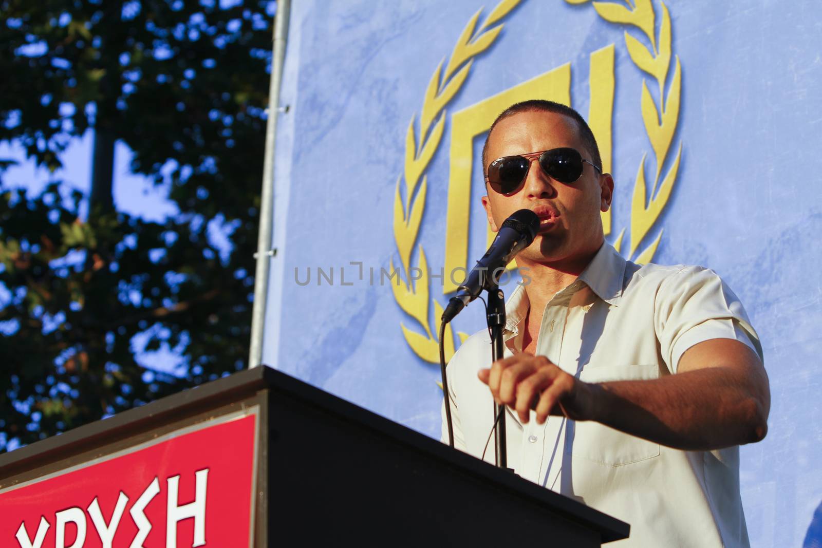 GREECE, Athens: Spokesperson Ilias Kasidiaris addresses the crowd as Greece's far-right Golden Dawn party holds an election rally in Athens on September 16, 2015, four days ahead of the country's snap national election. 