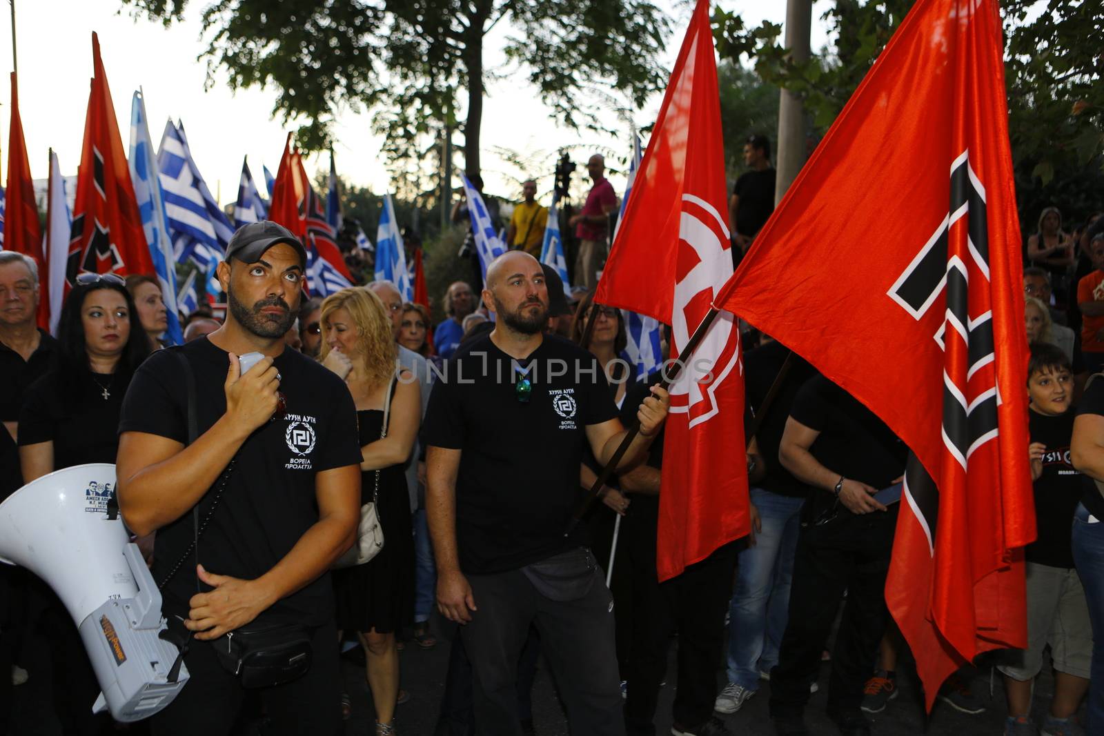 GREECE, Athens: A man shouts slogans to the crowd as Greece's far-right Golden Dawn party holds an election rally in Athens on September 16, 2015, four days ahead of the country's snap national election. 