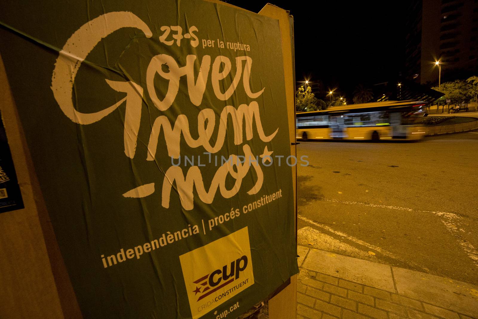 SPAIN, Barcelona: A poster supporting pro-independence political party Popular Unity Candidacy is displayed in Barcelona on the evening of September 16, 2015. Pro-independence groups are rallying their supporters ahead of the Catalonian parliamentary election, taking place on September 27.