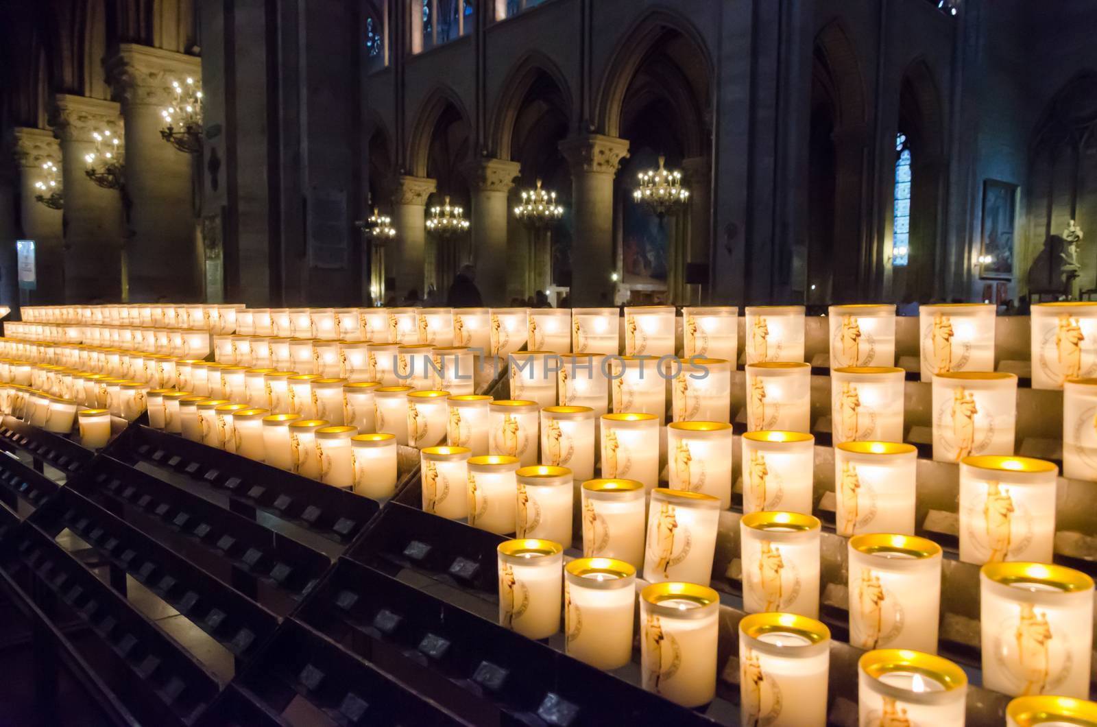 Church candles in Notre Dame Cathedral, Paris, France