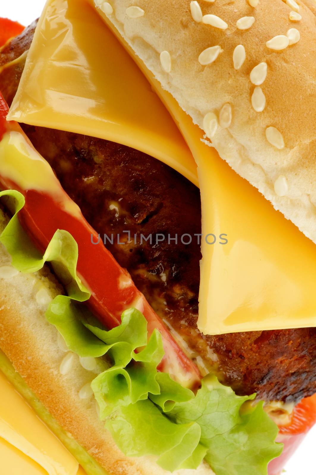 Big Tasty Cheeseburger with Beef, Tomato, Cheese, Lettuce and Sesame Bun closeup on white background