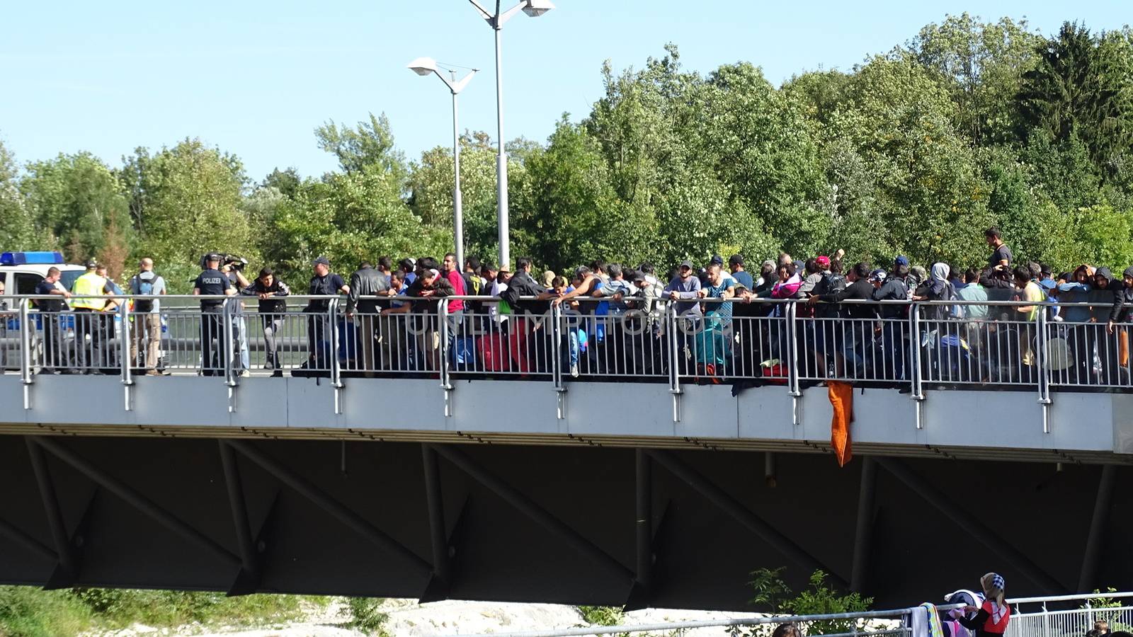 GERMANY, Freilassing: Refugees wait at the bridge on Austrai/Germany border, in Freilassing, Bavaria, on the German side of the Germany-Austria border, September 17, 2015.