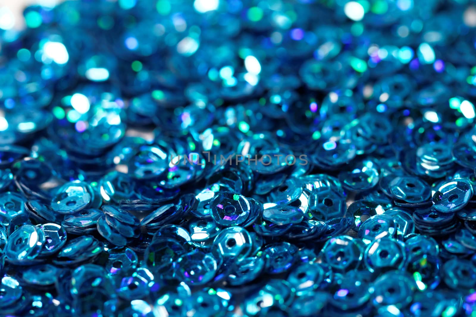 Close up photo lots of blue sequin