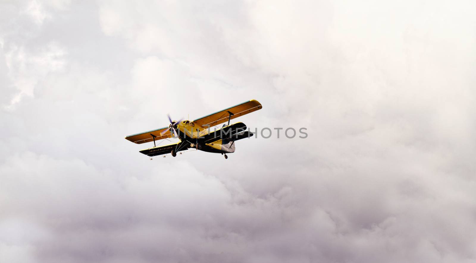 Photo of a plane on the cloudy sky