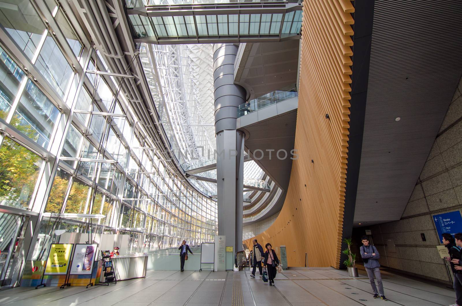 Tokyo, Japan - November 26, 2013: People visit Tokyo International Forum on November 26, 2013 in Tokyo Japan. the Forum is one of Tokyo's architectural marvels. Architect Rafael Vinoly won Japan's first international architecture competition with his design.