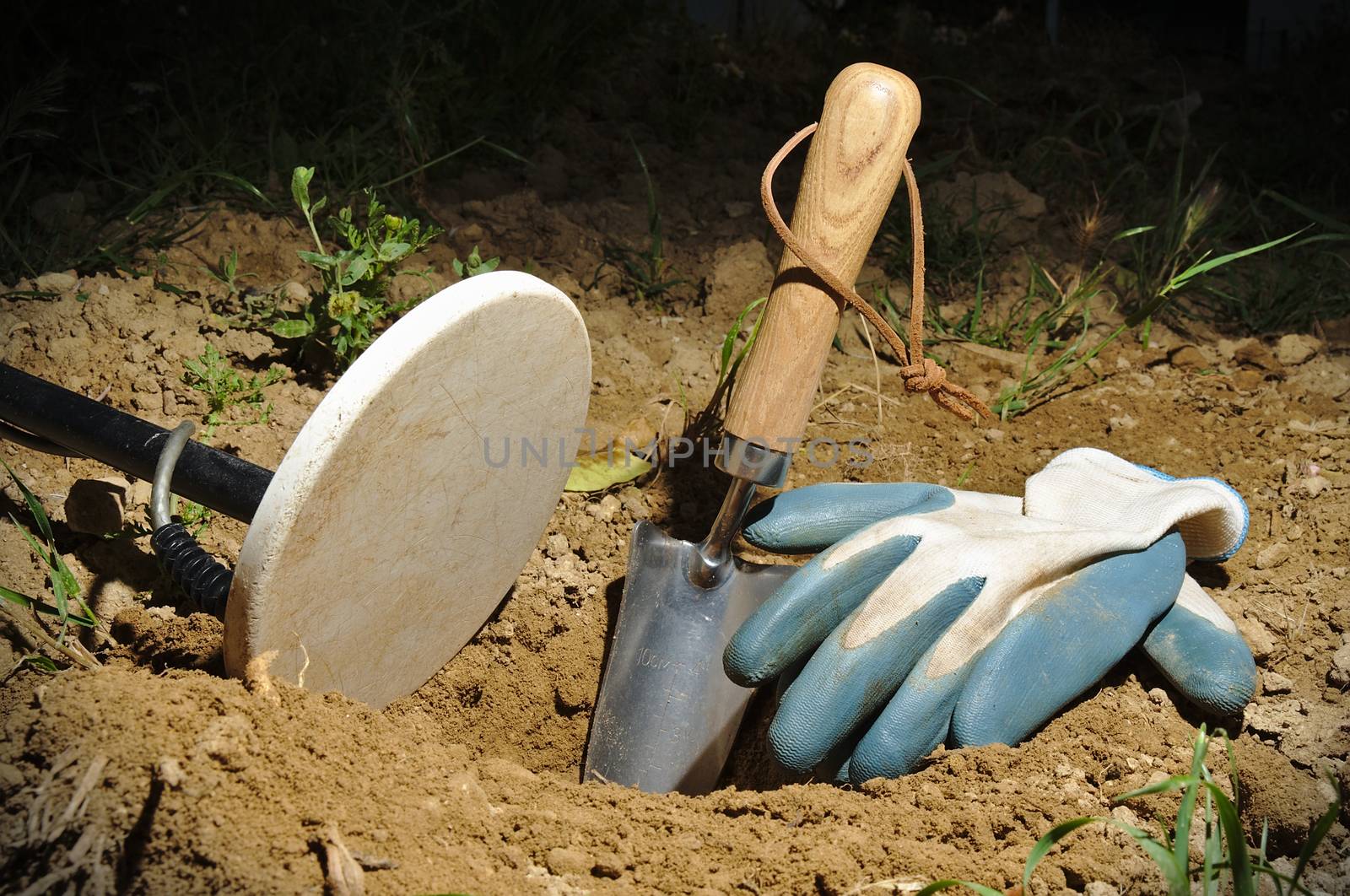 Night metal detecting. Metal detector coil, spade and gloves. Sports and hobbies