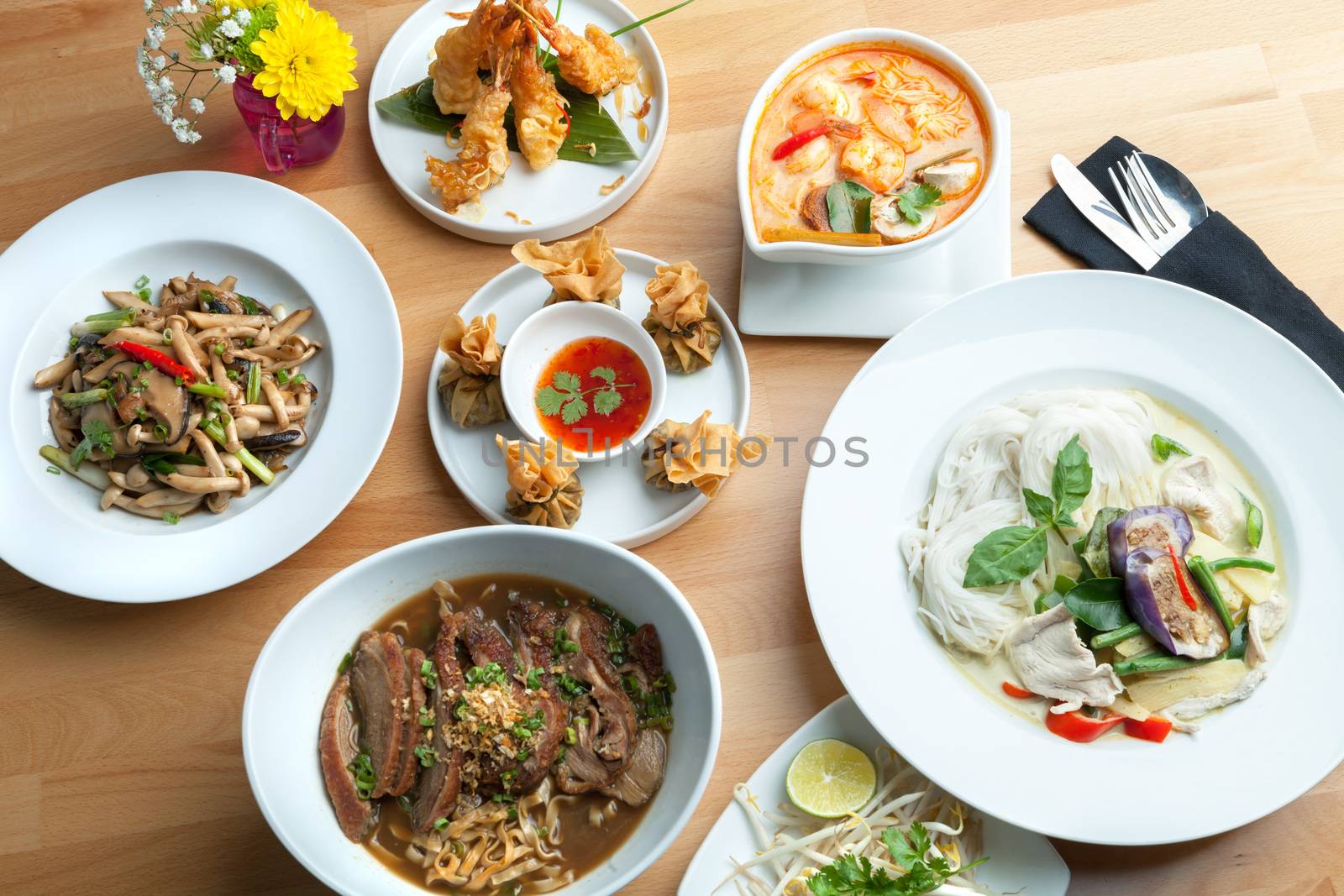 Variety of authentic Thai cuisine curries and stir fry dishes.  Shallow depth of field.