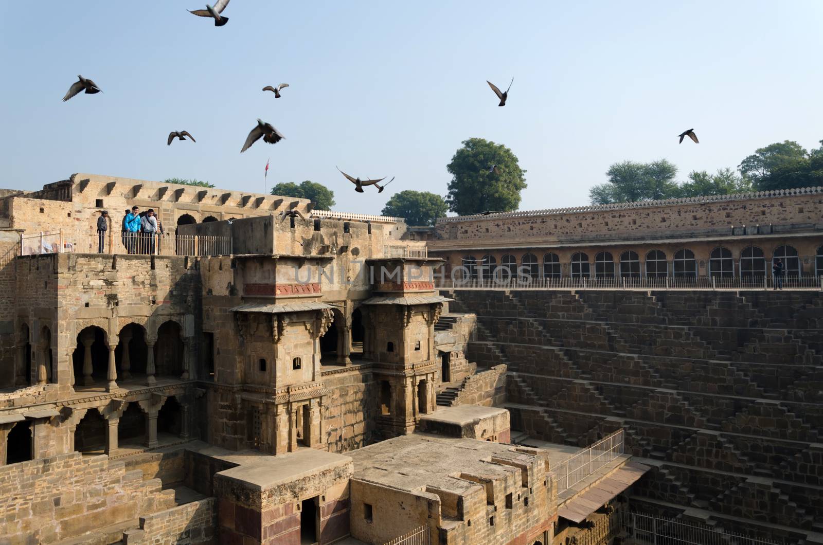 Jaipur, India - December 30, 2014: Tourist visit Chand Baori Stepwell, Jaipur, Rajasthan, India on December 30, 2014.  It was built by King Chanda of the Nikumbha Dynasty between 800 and 900 AD 