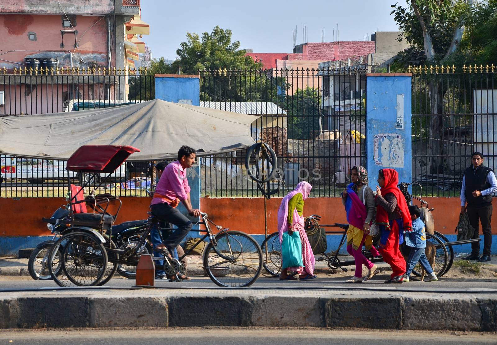 Jaipur, India - December 30, 2014: Indian people on Street of Pink City by siraanamwong