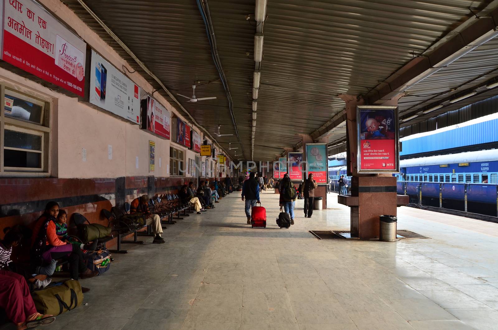Jaipur, India - January 3, 2015: Crowd on platforms at the railway station of Jaipur, Rajasthan, India. Indian Railways carries about 7,500 million passengers annually.