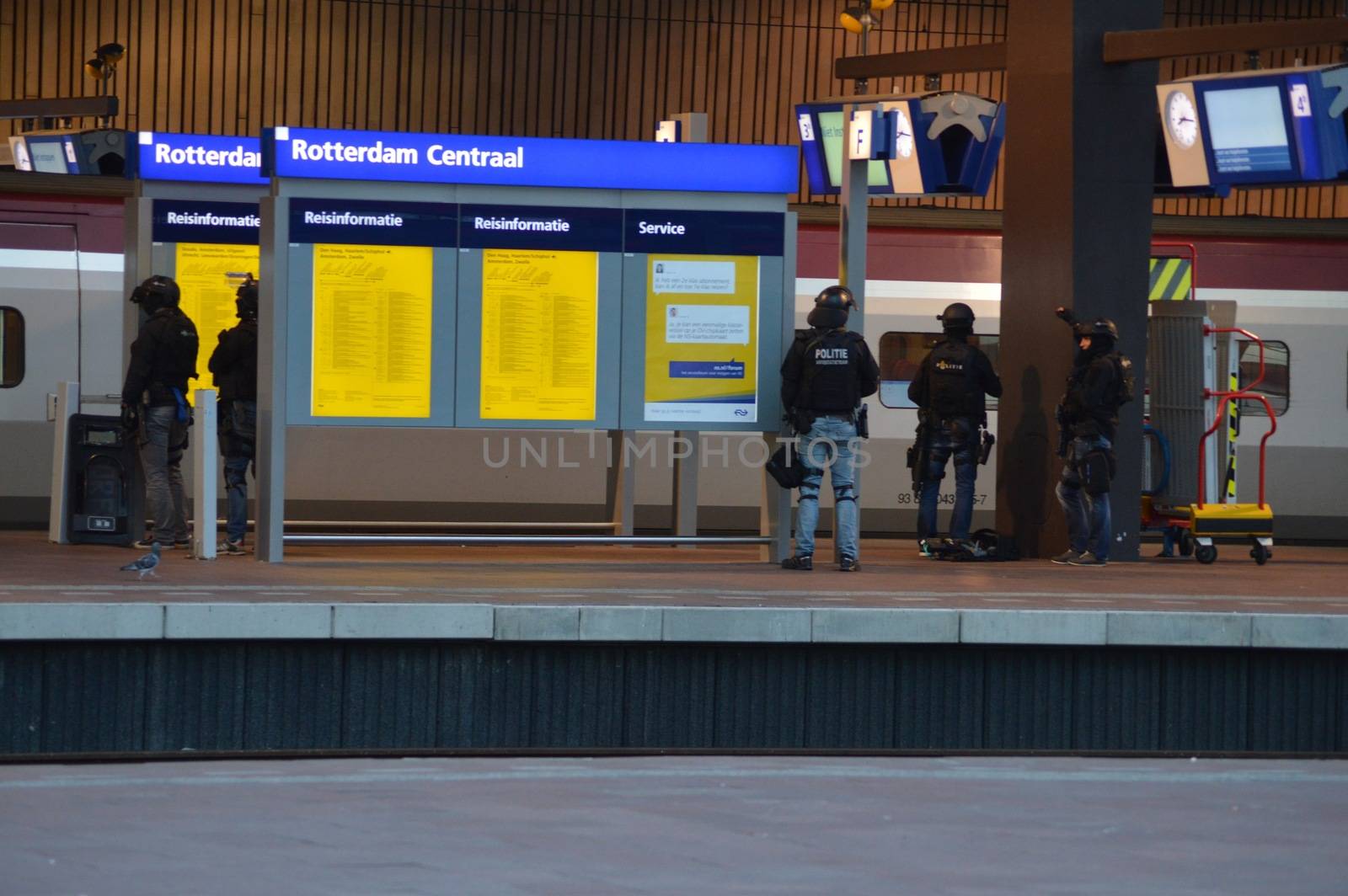 NETHERLANDS, Rotterdam: Members of a special unit of Dutch police stand guard near a Thalys train on a platform of Rotterdam central station, on September 18, 2015, as a man has locked himself in the train'sbathroom. The Thalys plus several platforms have been evicted.