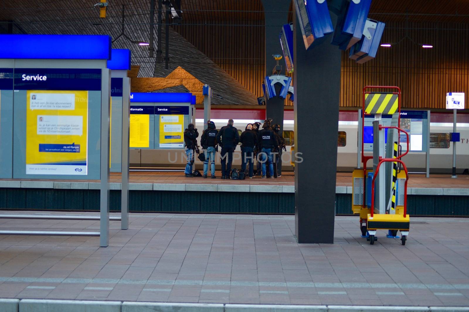 NETHERLANDS, Rotterdam: Members of a special unit of Dutch police stand guard near a Thalys train on a platform of Rotterdam central station, on September 18, 2015, as a man has locked himself in the train'sbathroom. The Thalys plus several platforms have been evicted.