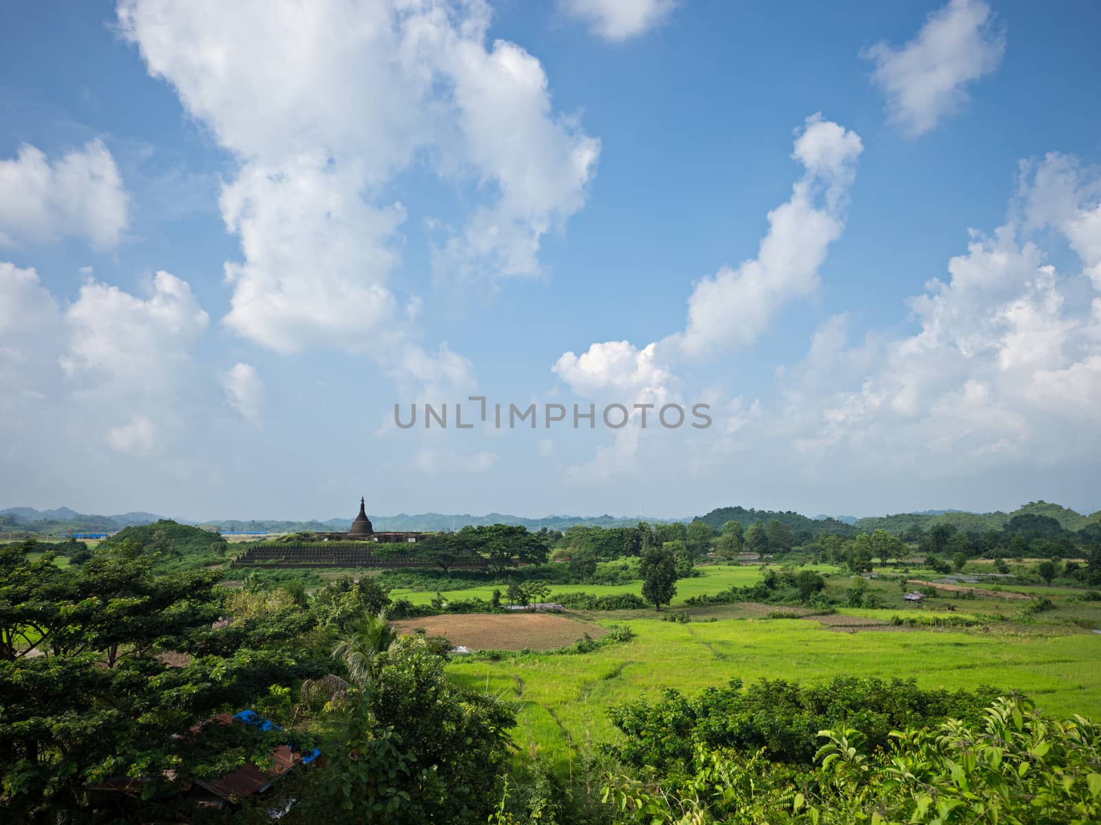 Landscape with the Koe-thaung Temple in the background, the temple of the 90,000 Buddhas, built by King Min Dikkha during the years 1554-1556 in Mrauk U, Rakhine State in Myanmar.