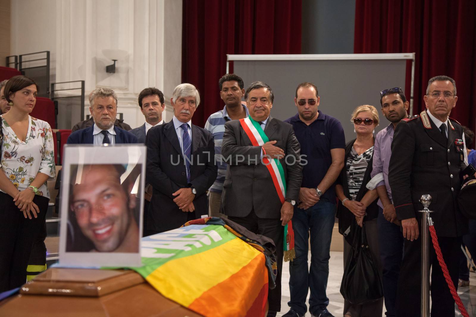 ITALY, Palermo: People look over coffin	The funeral of Giovanni Lo Porto was held on September 18, 2015, with Mayor Leoluca�Orlando declaring a day of mourning in the city.  	Lo Porto, an aid worker, was being held captive by al-Qaida along with American Warren Weinstein.  	The pair were mistakenly killed during a U.S. drone strike in January. 