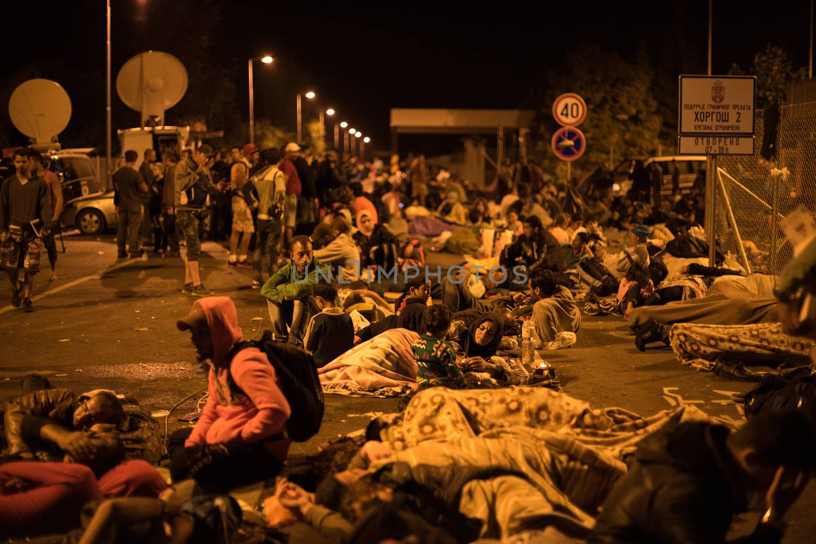 SERBIA, Horgos: Refugees, who wait to cross the border, have set their camp in the Serbian border town of Horgos on September 15, 2015.  